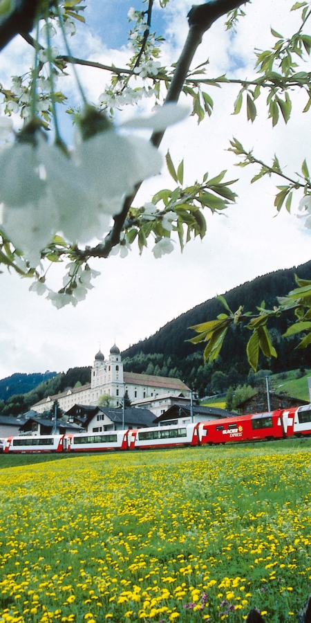 Glacier Express in front of the monastry Disentis